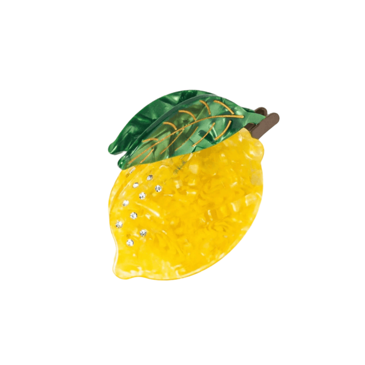 Decorative lemon with rhinestones on a white background