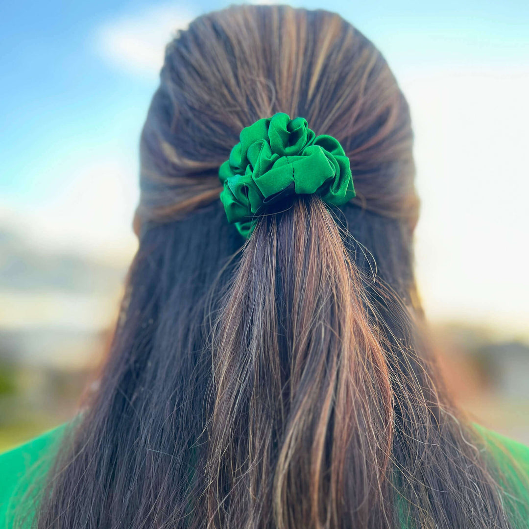 Girl wearing a green scrunchie to represent Mental Health Awareness